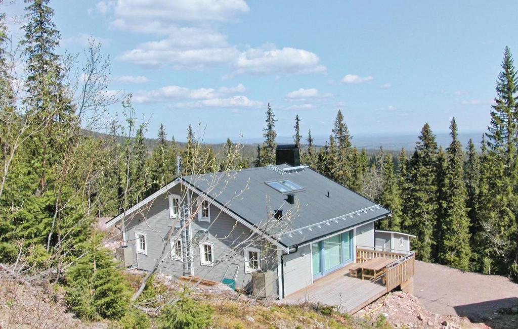a house on top of a hill with trees at 5 Bedroom Gorgeous Home In Slen in Lindvallen