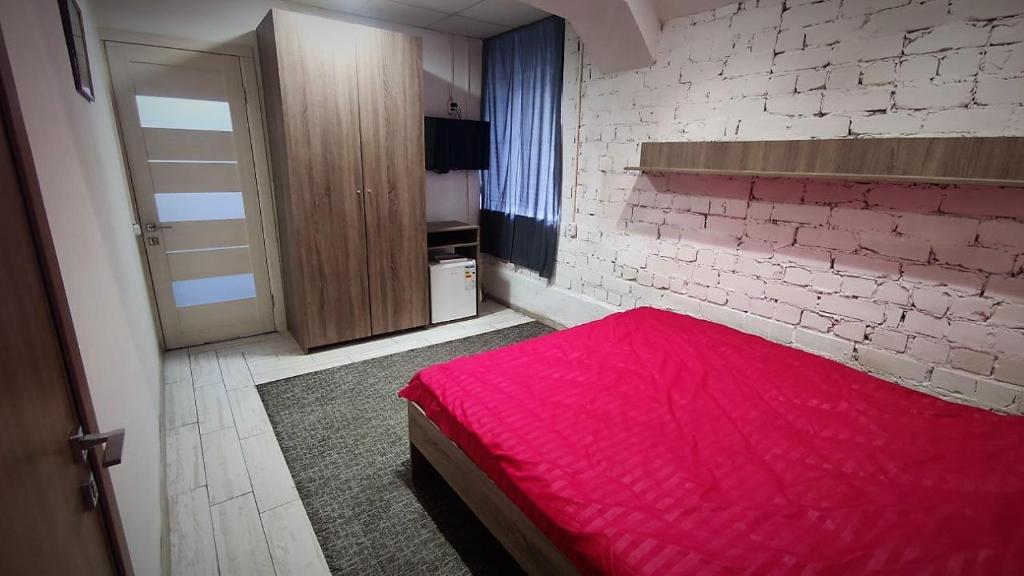 Postel nebo postele na pokoji v ubytování Міні Готель "БУНКЕР" на Солом'янському