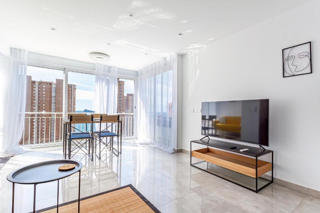 Телевизор и/или развлекательный центр в VIRGINIA Levante beach apartments