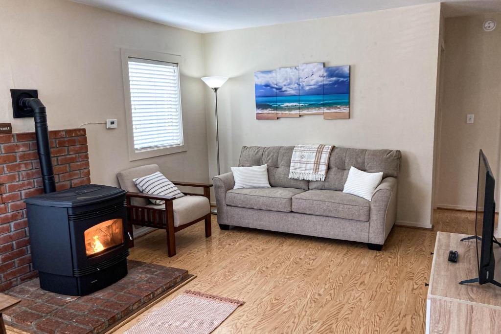 a living room with a couch and a fireplace at The Heart of Trinidad in Trinidad