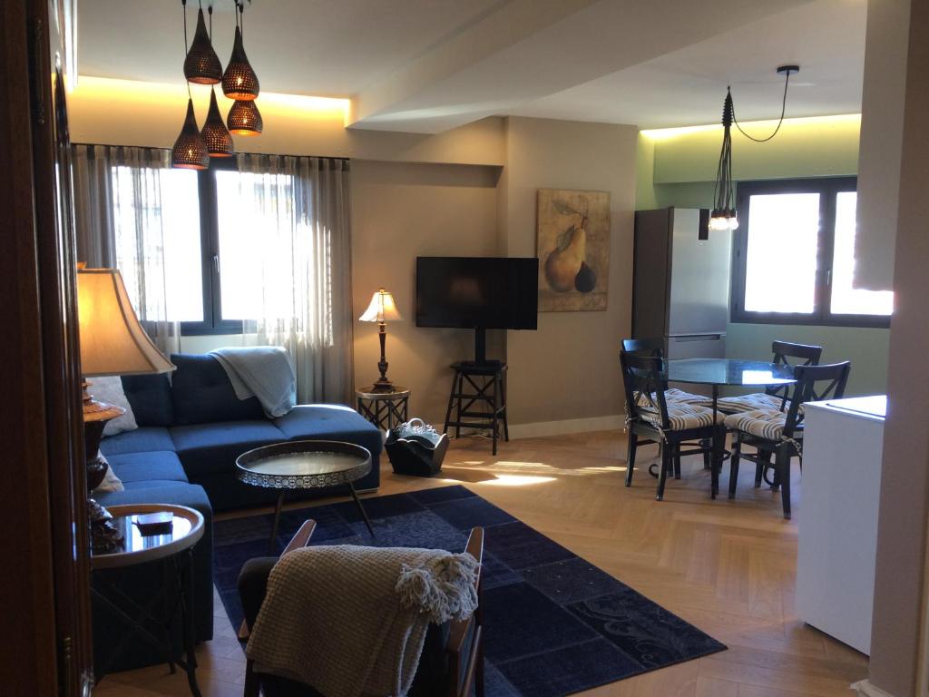 a living room with a couch and a table at Lovely Refurbished Apartment in Nice