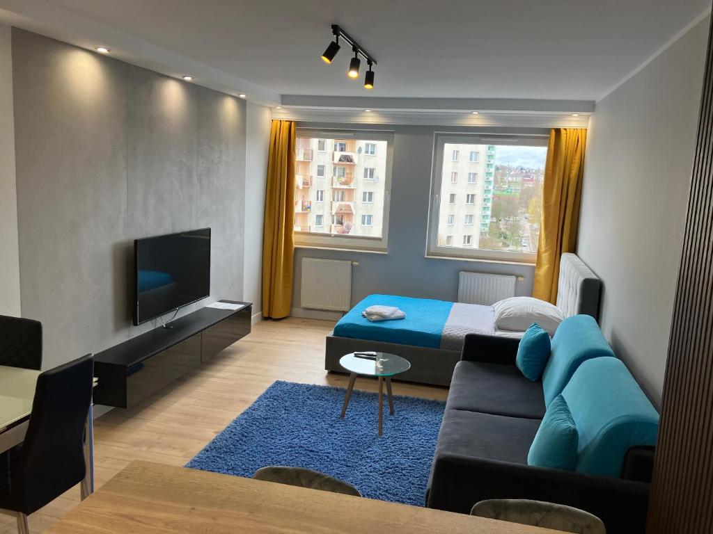 TV a/nebo společenská místnost v ubytování JAB Apartments Bandurskiego Business & Family