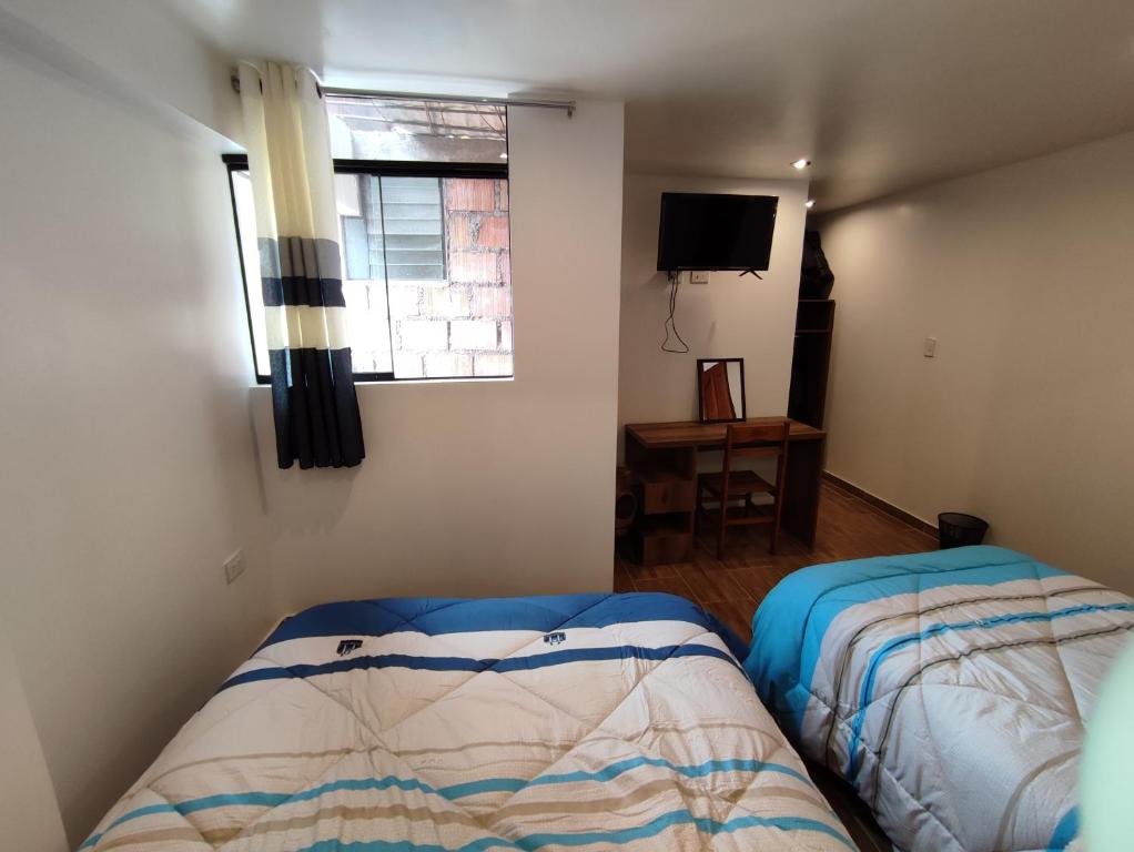 Postel nebo postele na pokoji v ubytování linda house cusco