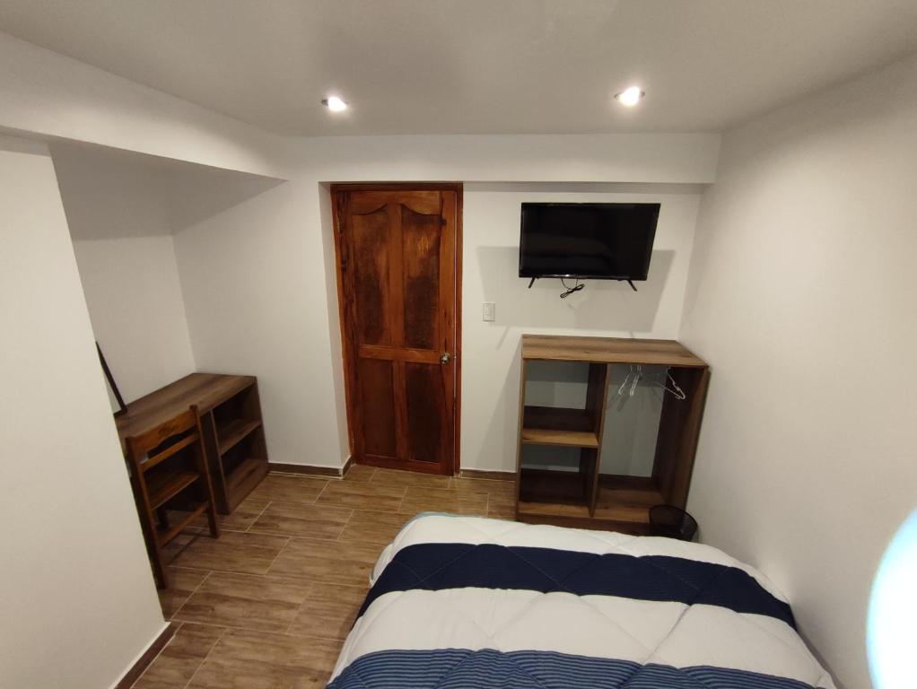 Postel nebo postele na pokoji v ubytování linda house cusco