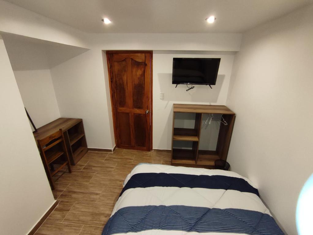 TV a/nebo společenská místnost v ubytování linda house cusco