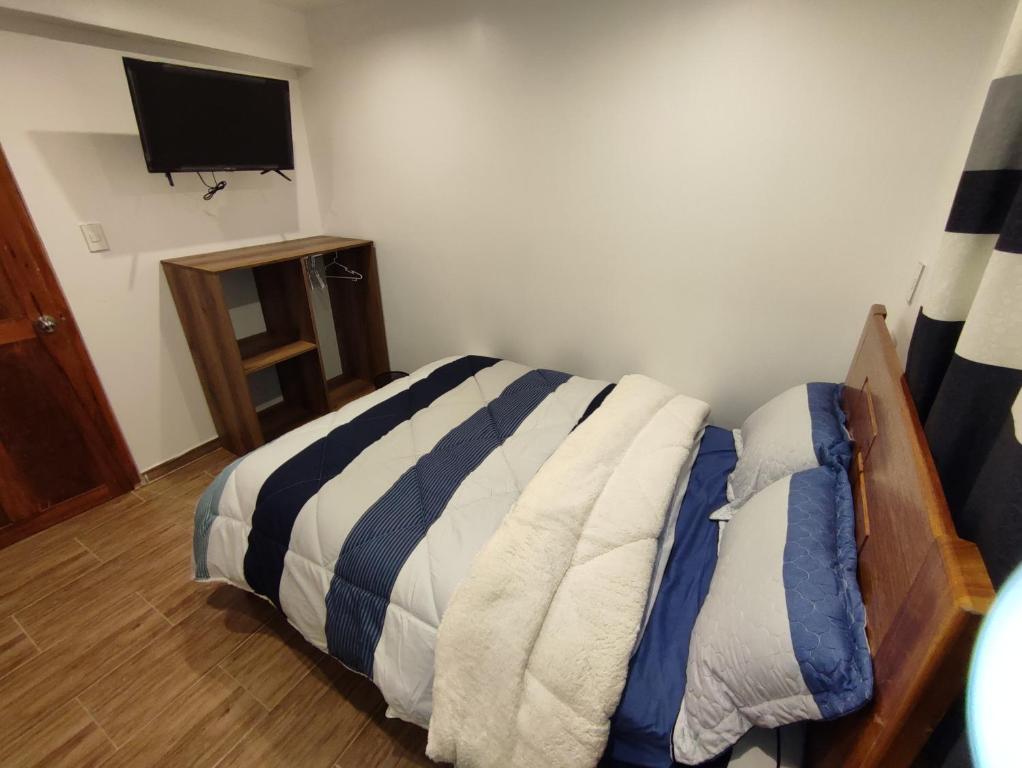 Postel nebo postele na pokoji v ubytování linda house cusco
