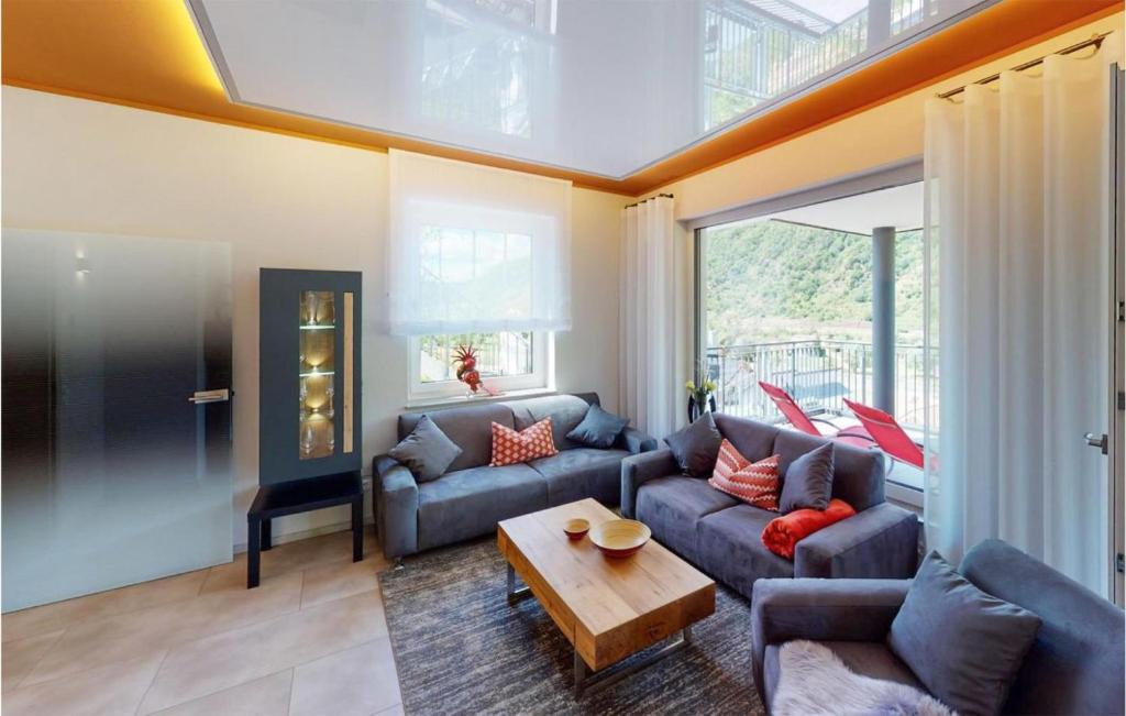 a living room with a couch and a table at 2 Bedroom Gorgeous Apartment In Burgen in Burgen