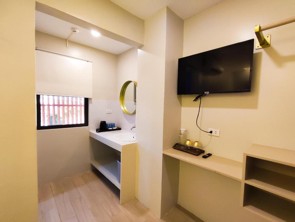 TV a/nebo společenská místnost v ubytování Hotel Simone Kalibo