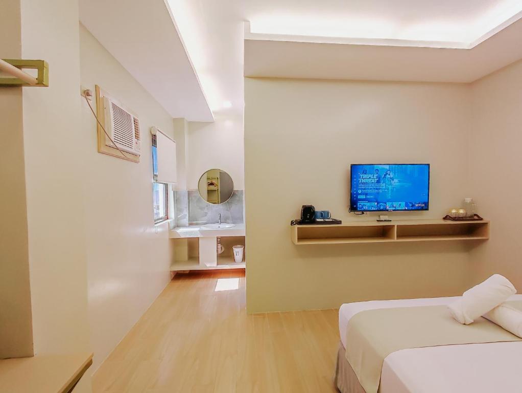 TV a/nebo společenská místnost v ubytování Hotel Simone Kalibo