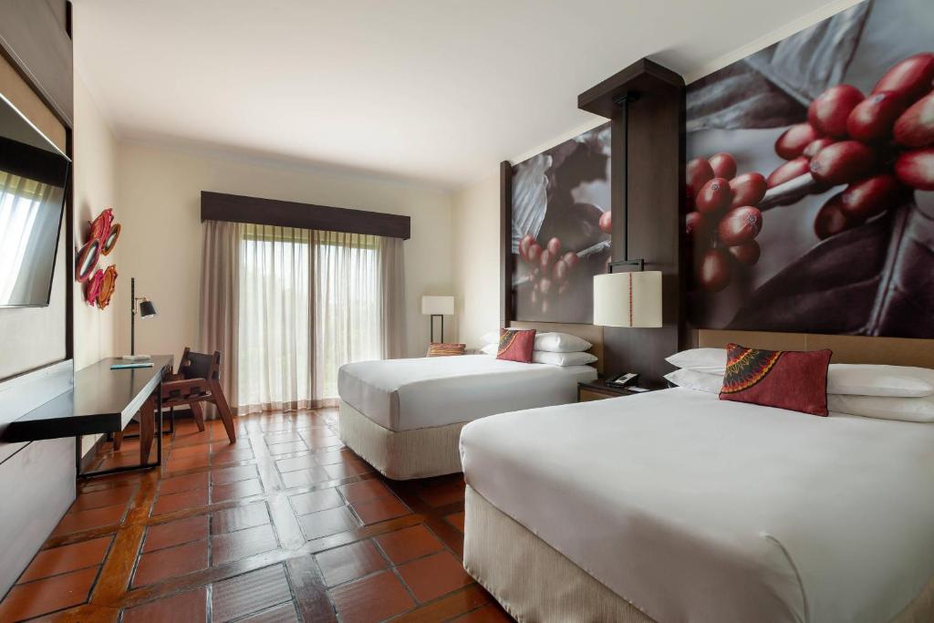 Postel nebo postele na pokoji v ubytování Costa Rica Marriott Hotel Hacienda Belen