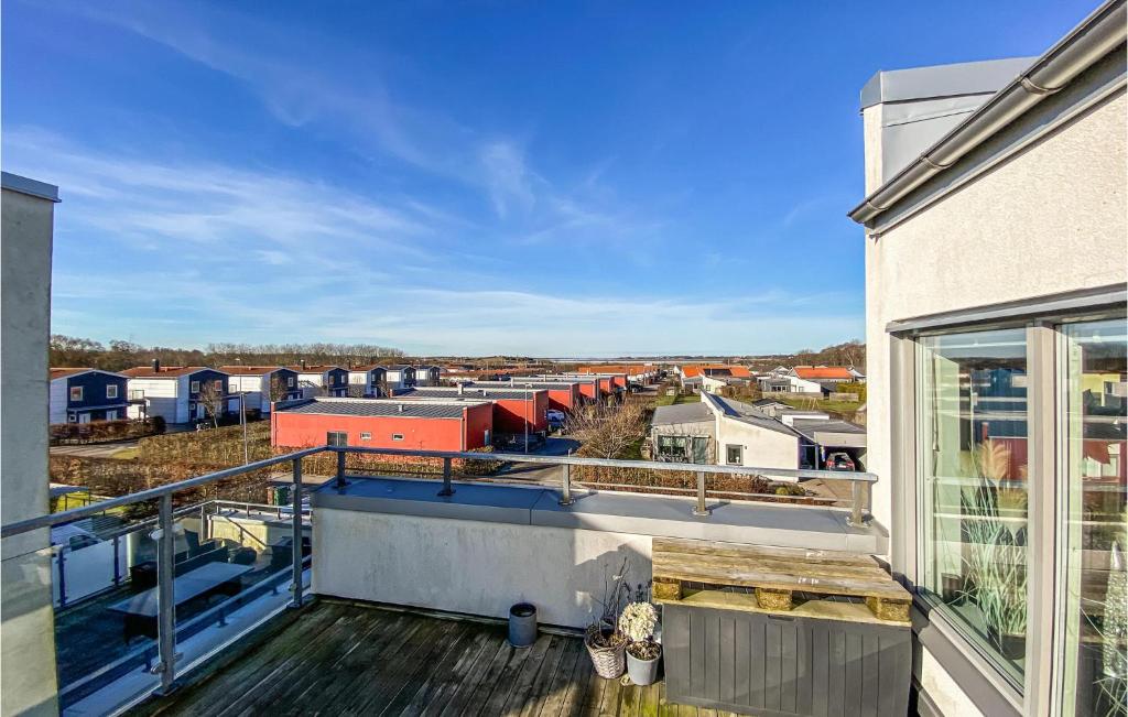 an apartment balcony with a view of a city at Awesome Home In Varberg With Wifi And 6 Bedrooms in Varberg