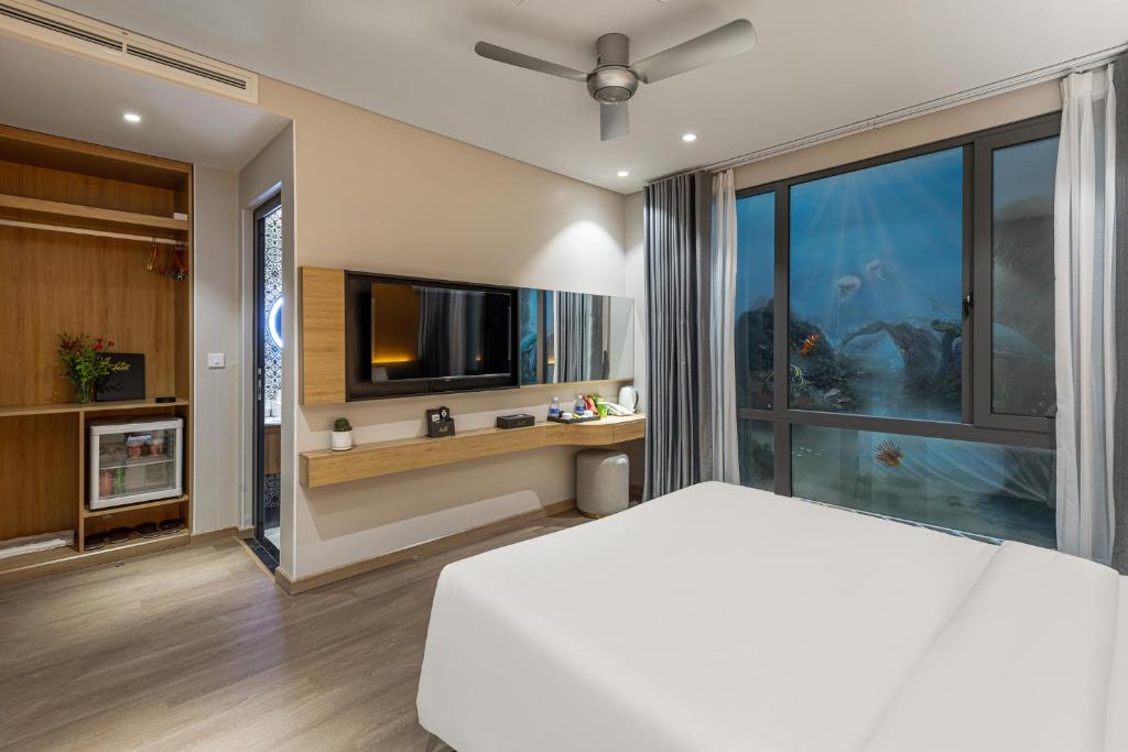 Postel nebo postele na pokoji v ubytování Laputa Hotel Phu Quoc