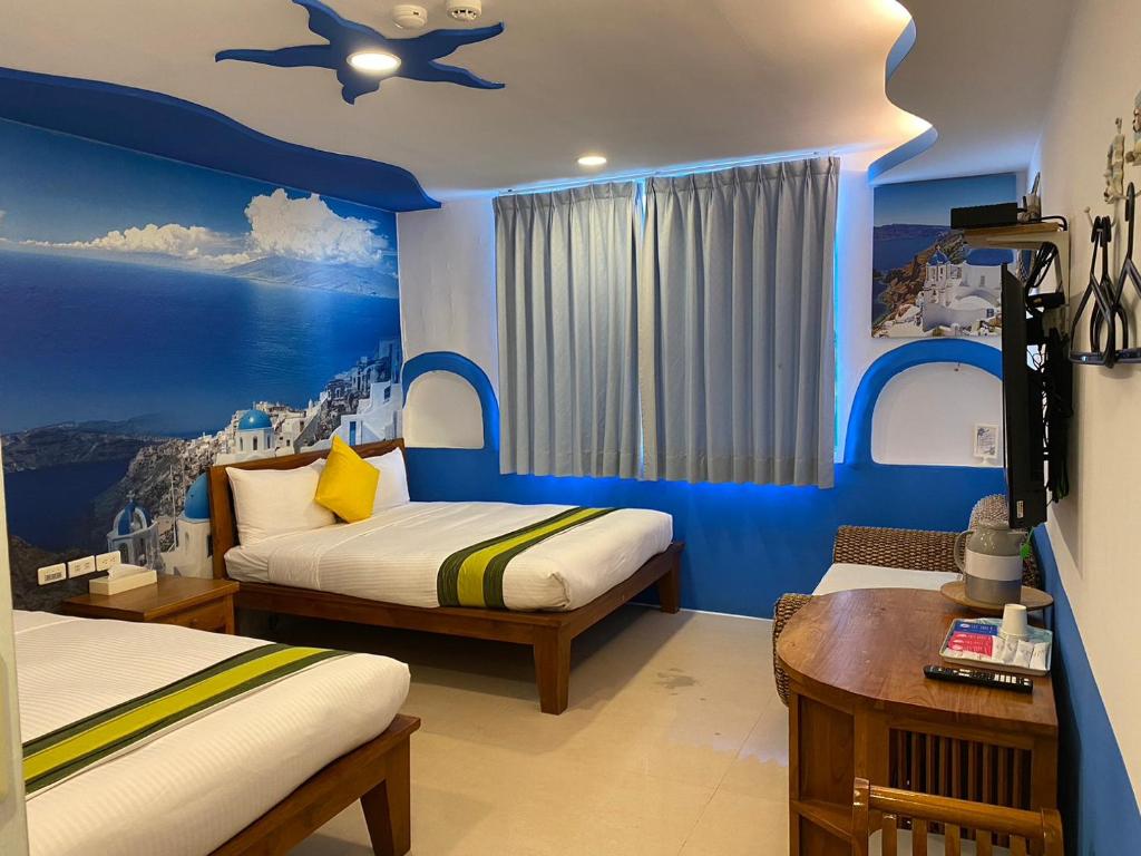 Postel nebo postele na pokoji v ubytování Kenting Sin Sin Hotel