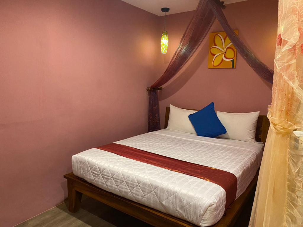 Postel nebo postele na pokoji v ubytování Kenting Sin Sin Hotel