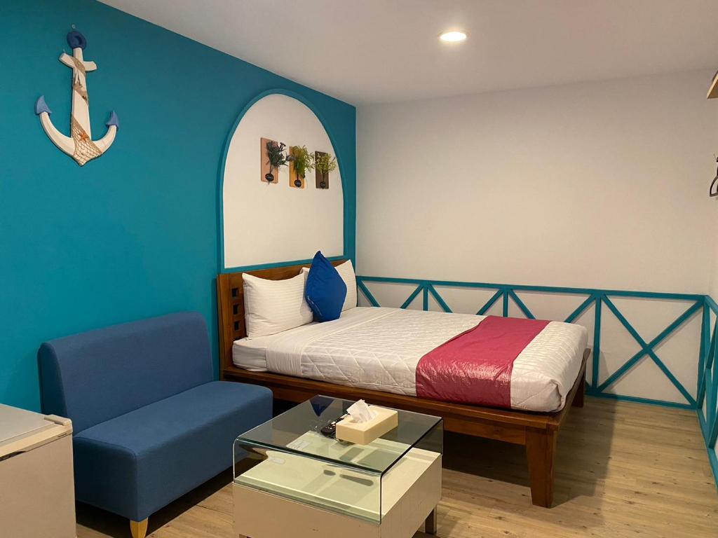 Postel nebo postele na pokoji v ubytování Kenting Sin Sin Hotel