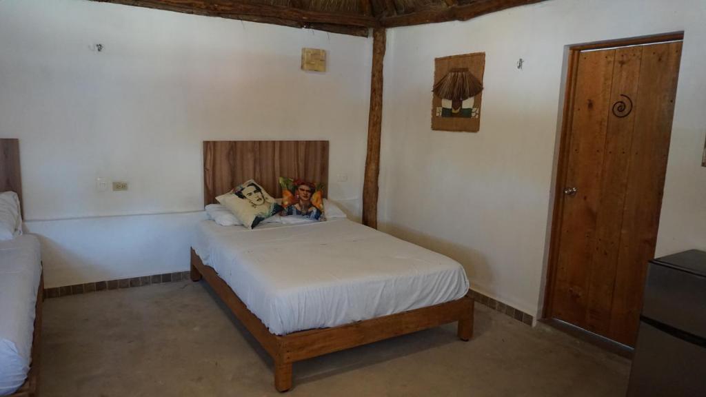 Postel nebo postele na pokoji v ubytování Casa Frida