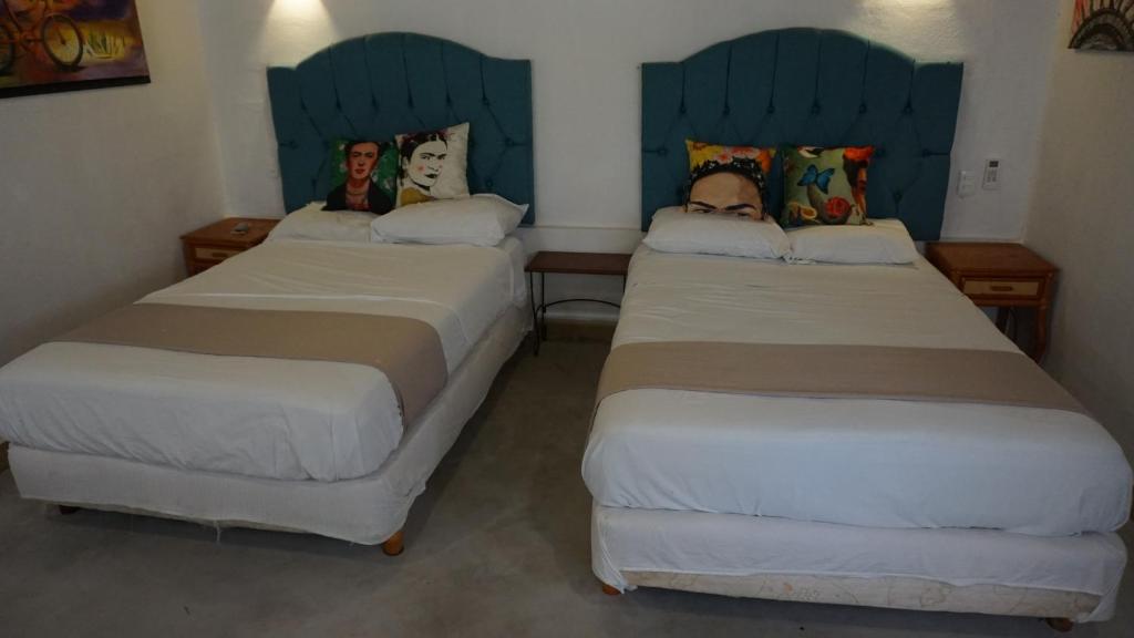 Postel nebo postele na pokoji v ubytování Casa Frida