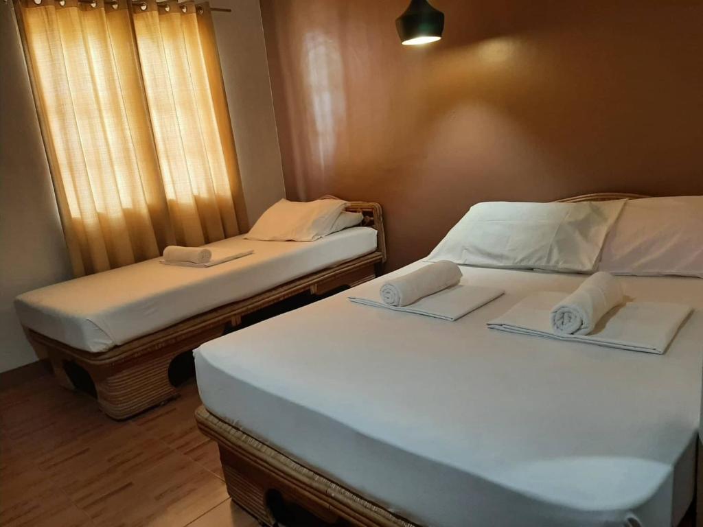Postel nebo postele na pokoji v ubytování Panglao Grande Resort 邦劳美丽度假村