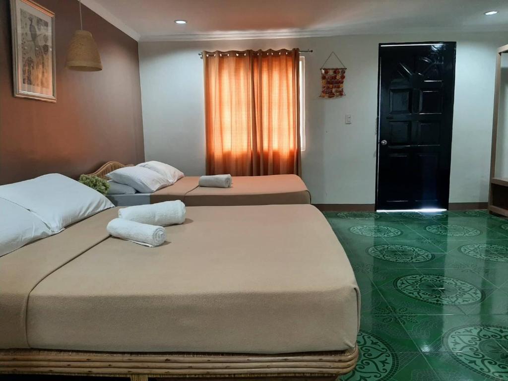 Postel nebo postele na pokoji v ubytování Panglao Grande Resort 邦劳美丽度假村