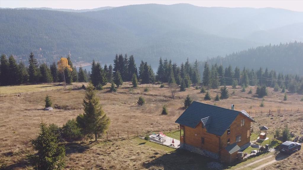 an aerial view of a house in a field at Cabana Perla Transilvaniei in Cluj-Napoca