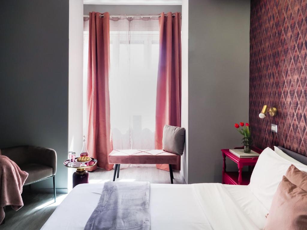 Postel nebo postele na pokoji v ubytování C'est La Vie Suites