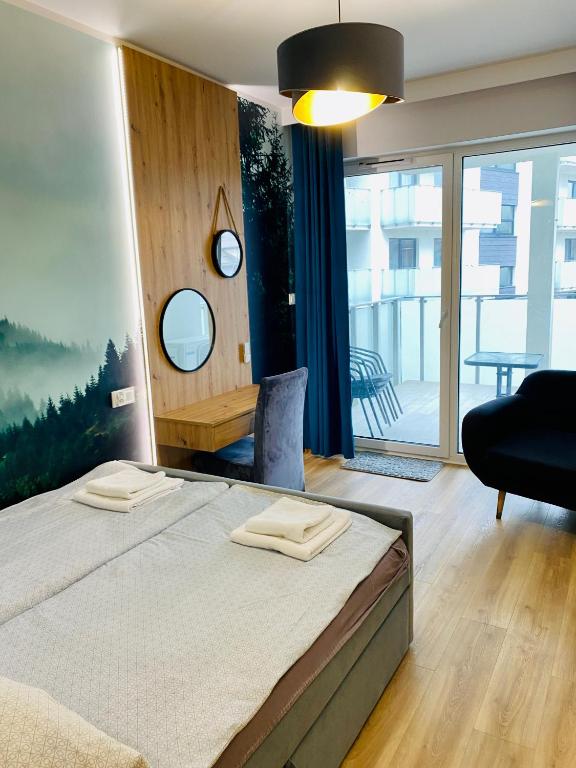 Postel nebo postele na pokoji v ubytování Apartamenty Białe nad jeziorem Białym