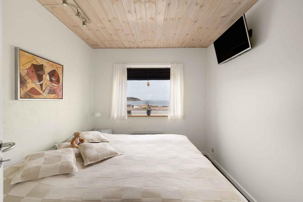 En eller flere senge i et værelse på Holiday With Panoramic Views On The Rocks, Bornholm