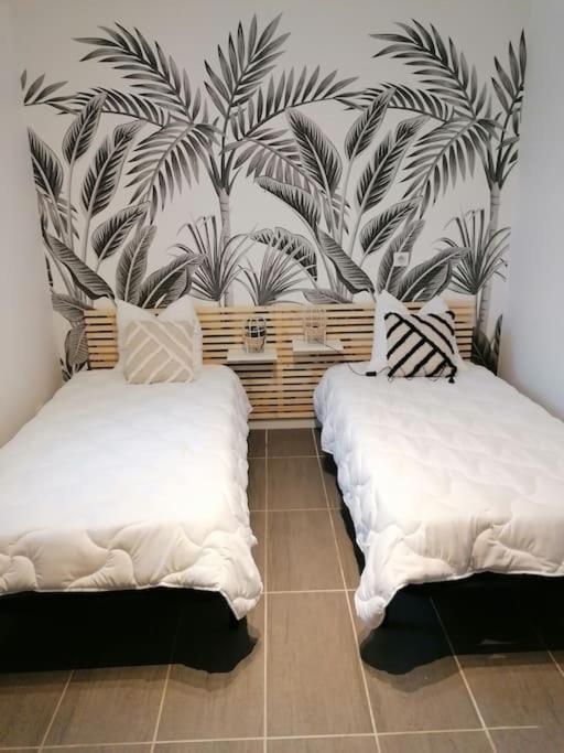 Posteľ alebo postele v izbe v ubytovaní Maison proche la Rochelle