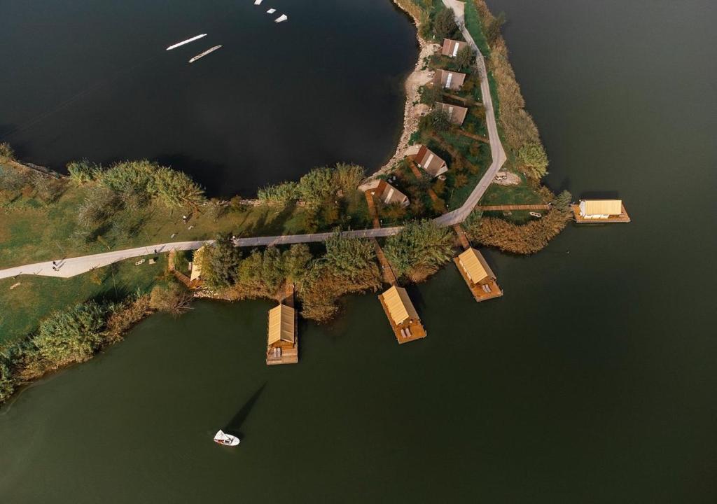 an aerial view of a bridge over a body of water at Nabi Resort Glamping & SPA in Castel Volturno