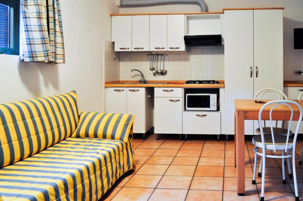 Kuchyň nebo kuchyňský kout v ubytování Residence Le Mimose