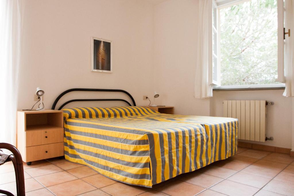 Postel nebo postele na pokoji v ubytování Residence Le Mimose