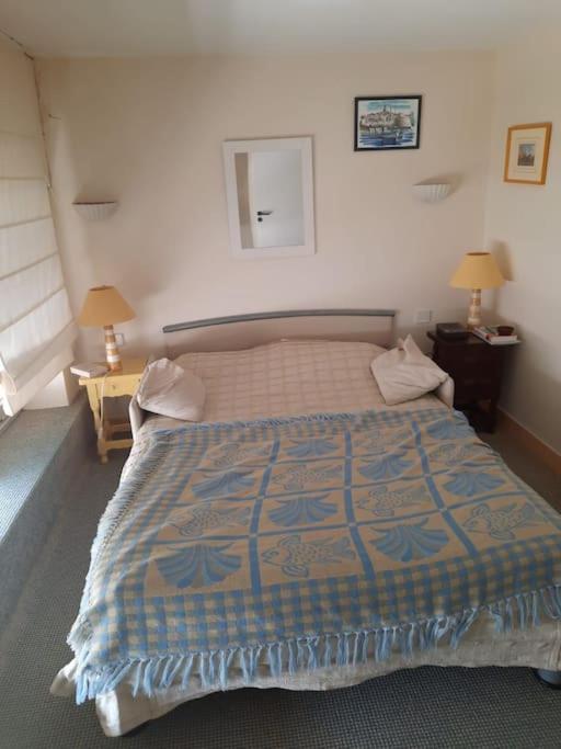 Łóżko lub łóżka w pokoju w obiekcie Le Nautile, résidence Les Corailleurs, duplex surplombant la mer, 6 pers