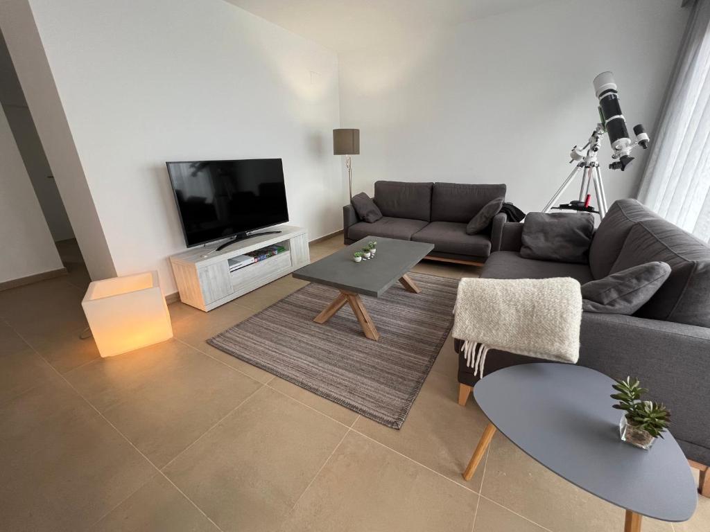 Televízia a/alebo spoločenská miestnosť v ubytovaní Penthouse with stunning view and rooftop terrace