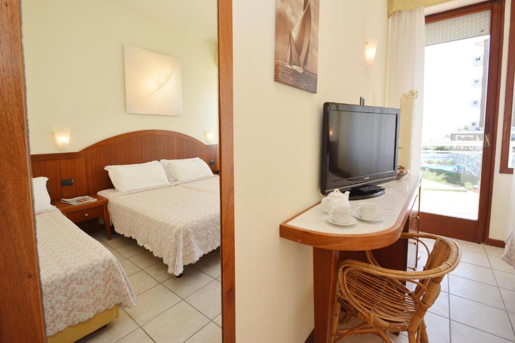 Postel nebo postele na pokoji v ubytování Hotel Bellevue Beach - sul mare