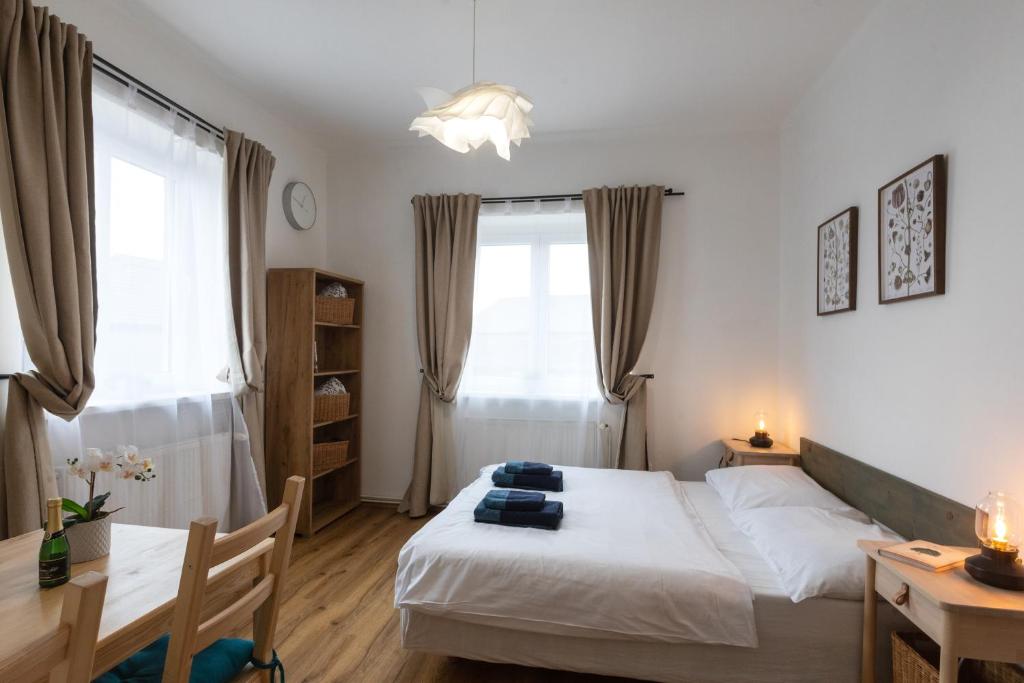 Postel nebo postele na pokoji v ubytování Chata u kostela