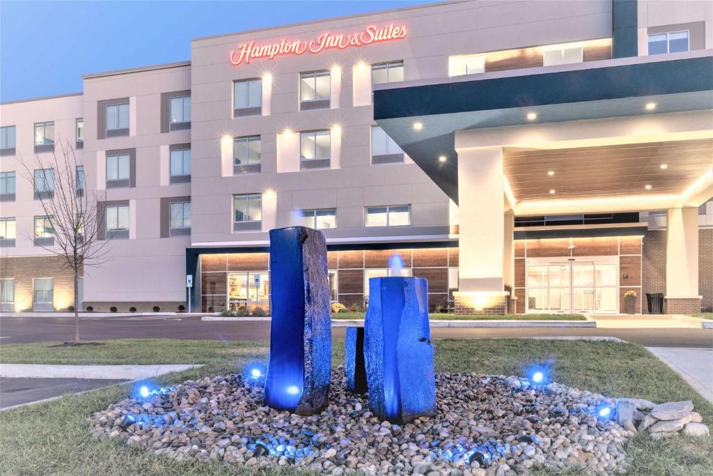 a sculpture in front of a building at Hampton Inn & Suites Cincinnati West, Oh in Dent