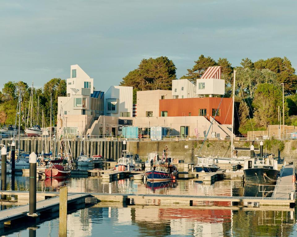 a group of boats are docked in a marina at East Quay in Watchet