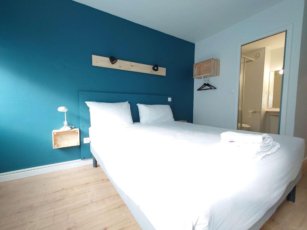 Postel nebo postele na pokoji v ubytování greet hotel Grenoble Centre Gare