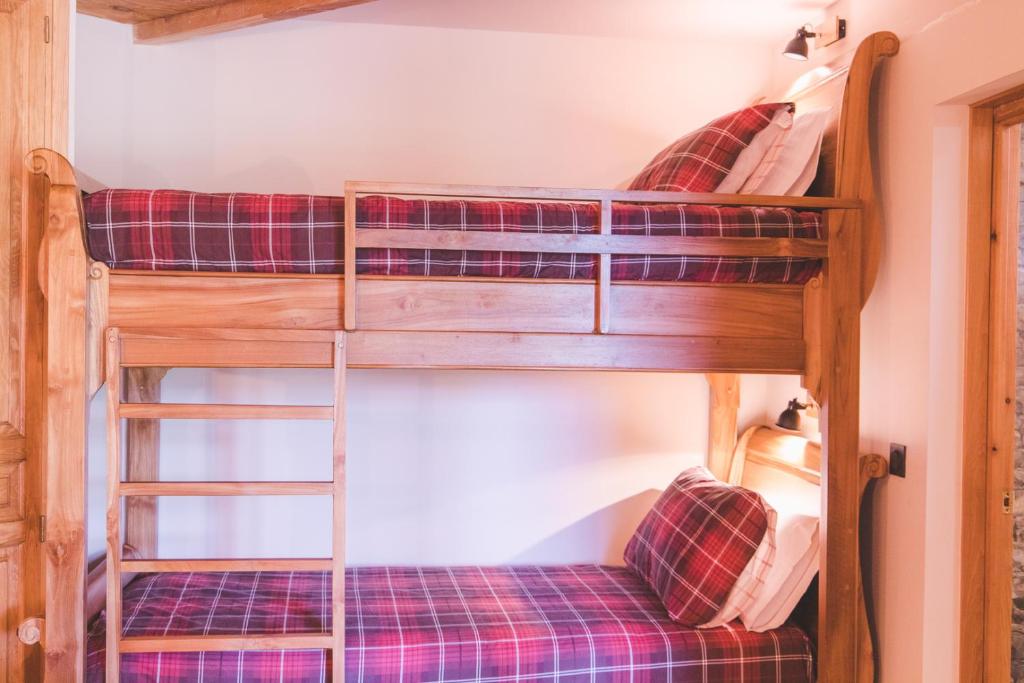 Postel nebo postele na pokoji v ubytování La Masia Del Taulat Chambres d´Hôtes