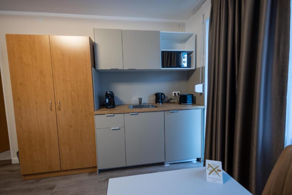 Kuchyň nebo kuchyňský kout v ubytování Hotel Schlangenbader Hof