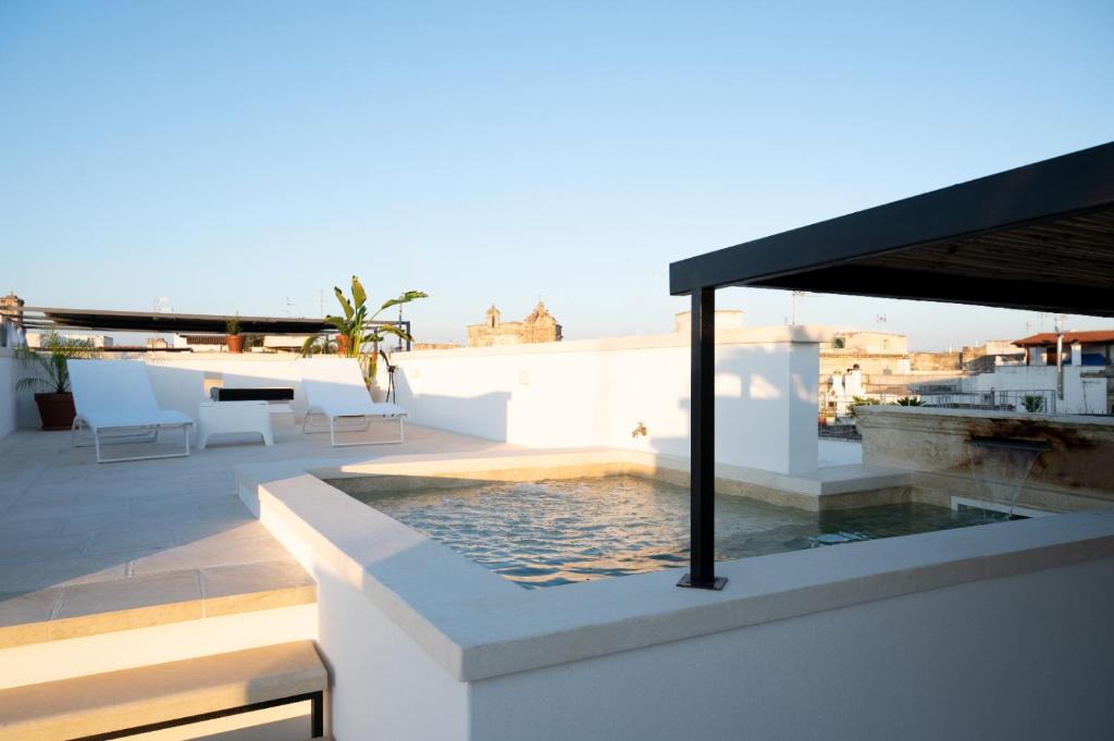 a swimming pool on the roof of a house at Suite Guagnano Luxury apartment in Nardò