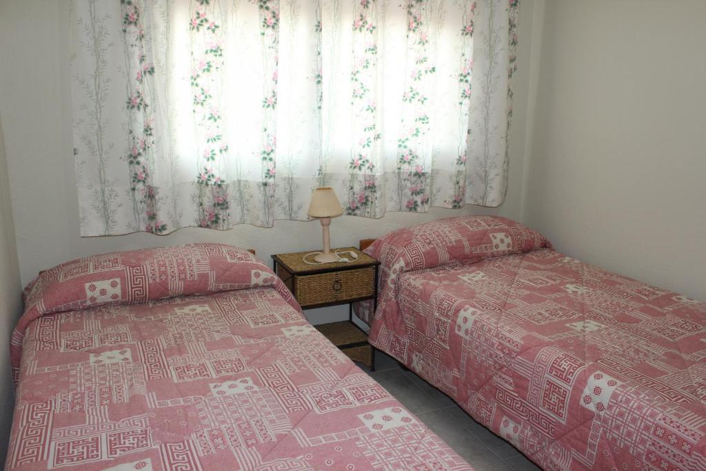 Postel nebo postele na pokoji v ubytování 165 Talima D-13 - Deniasol