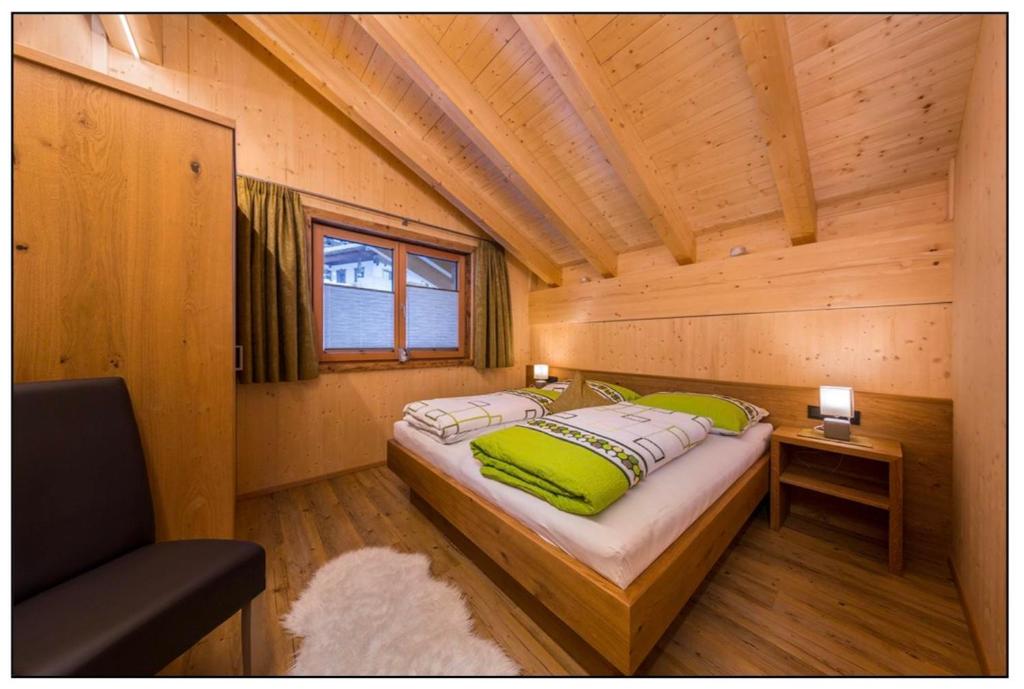 Voodi või voodid majutusasutuse Ferienchalet Elisabeth toas
