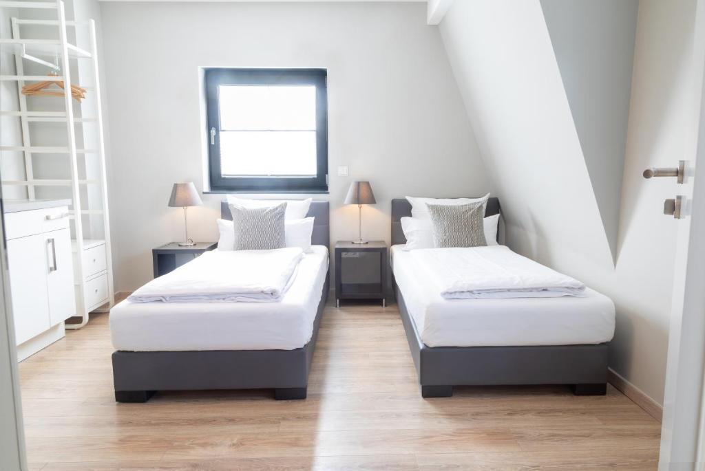 Postel nebo postele na pokoji v ubytování NürbLife Hotel