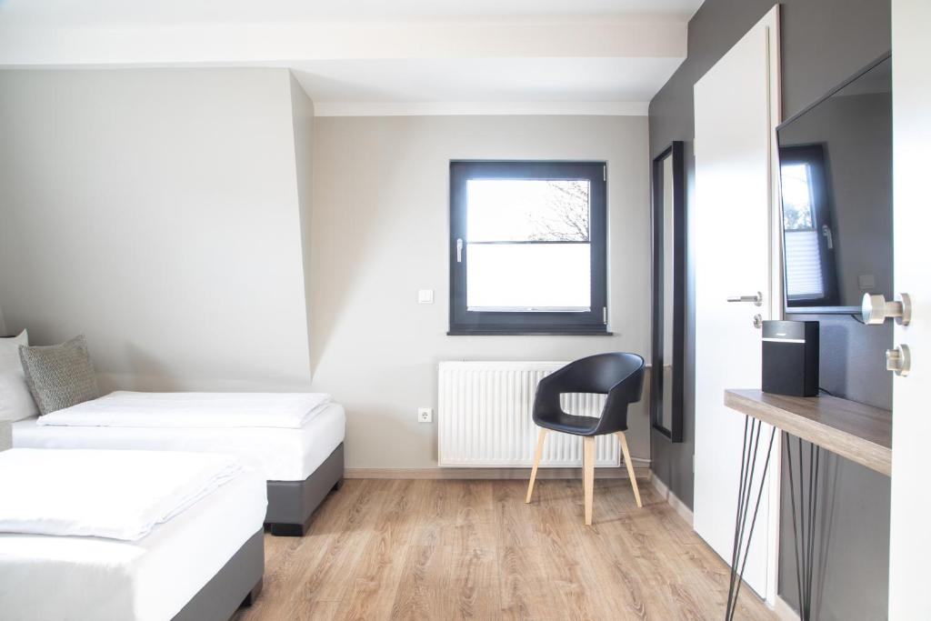 Postel nebo postele na pokoji v ubytování NürbLife Hotel
