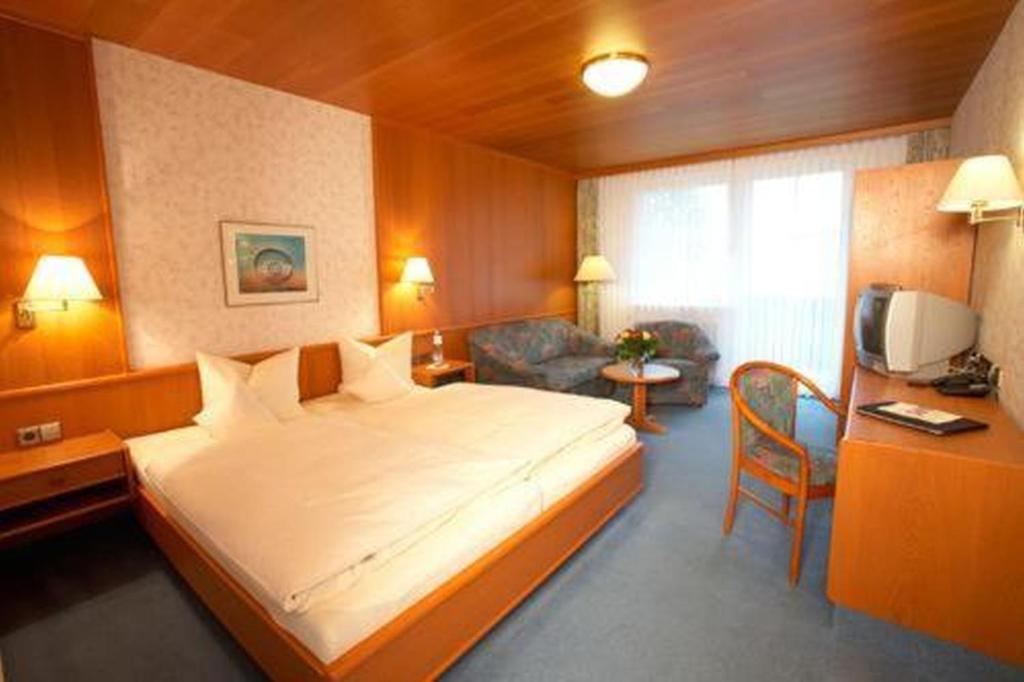 Postel nebo postele na pokoji v ubytování Hotel Tannhof