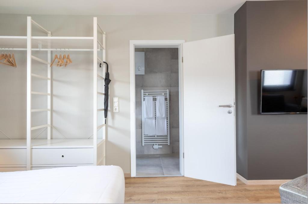 Postel nebo postele na pokoji v ubytování NürbLife Hotel