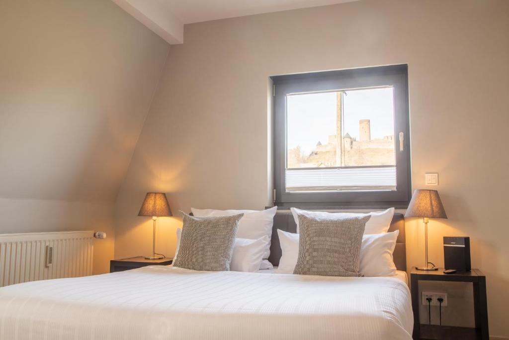 Postel nebo postele na pokoji v ubytování NürbLife Hotel