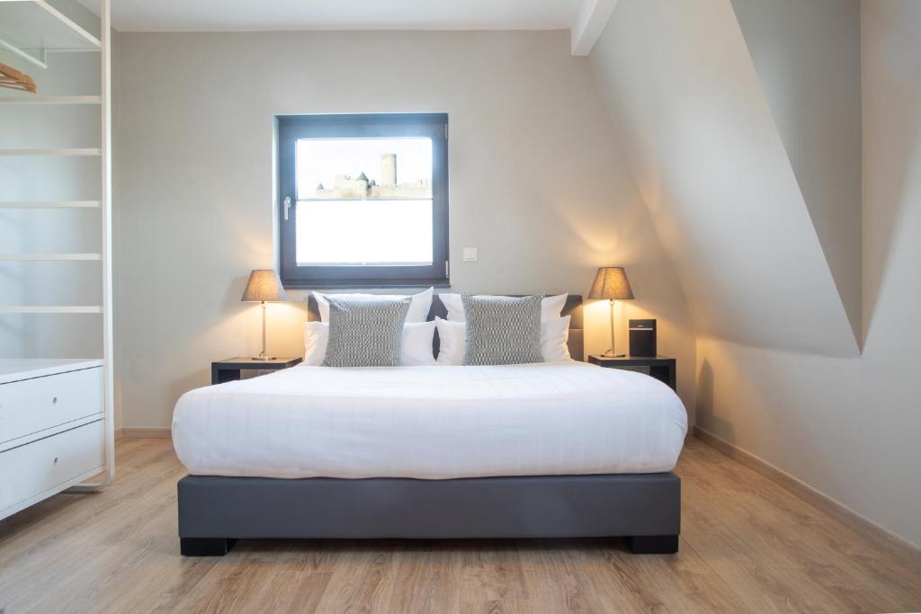 Postel nebo postele na pokoji v ubytování NürbLife Hotel