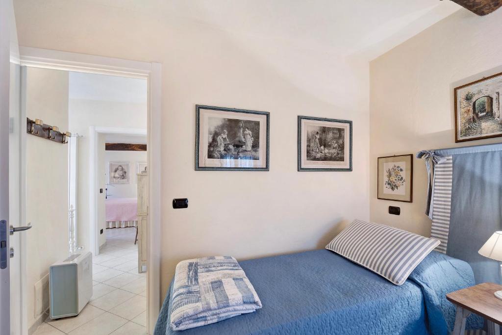 Postel nebo postele na pokoji v ubytování Casa dei Tigli